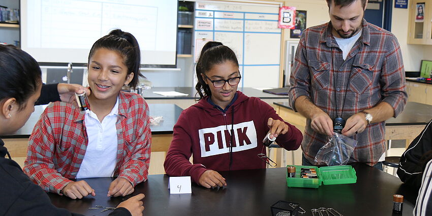 students doing a science experiment