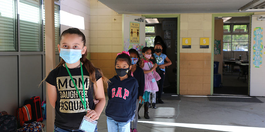 students line up outside classroom