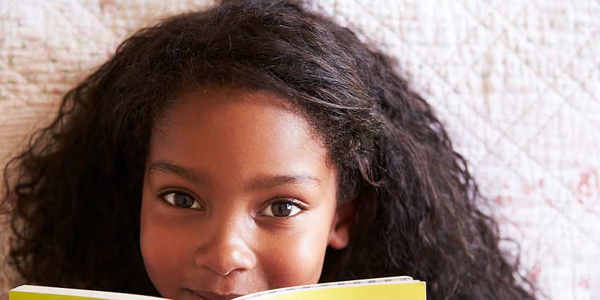 happy girl reading a book