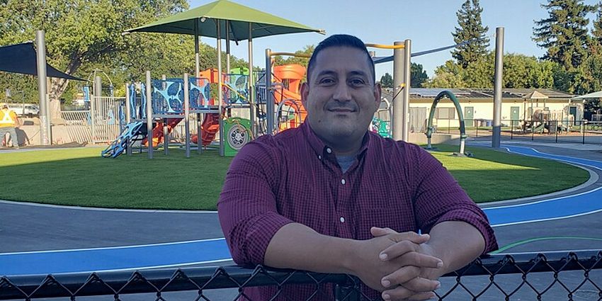 Hugo Galvan standing near playground