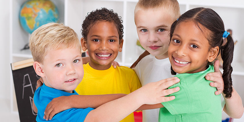 four kids hugging