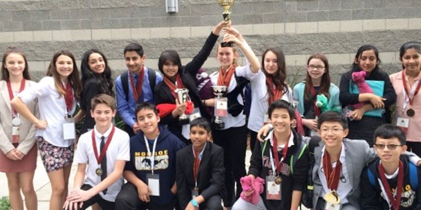 Monroe Middle School's 2018 World Scholars Cup Team with trophy