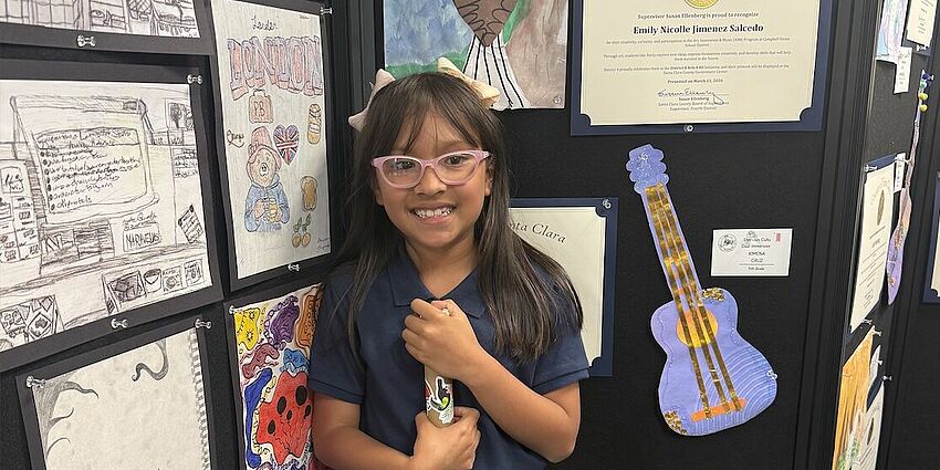 student artist with her eagle art