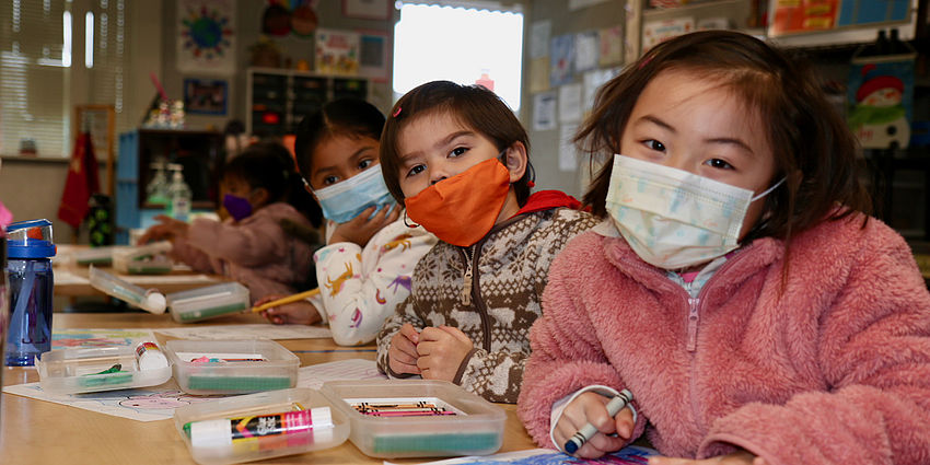 three tk students in classroom