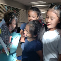 Students looking at a new book