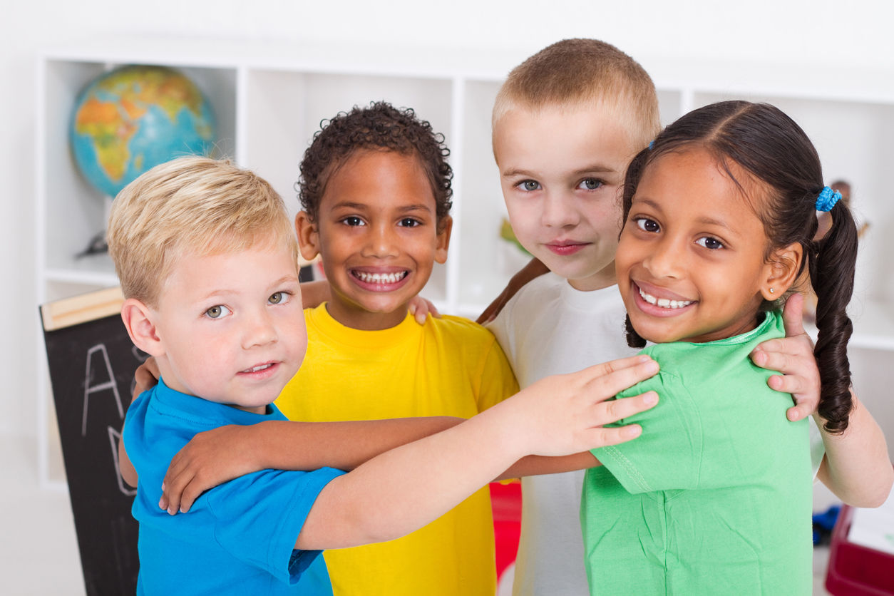 four kids hugging