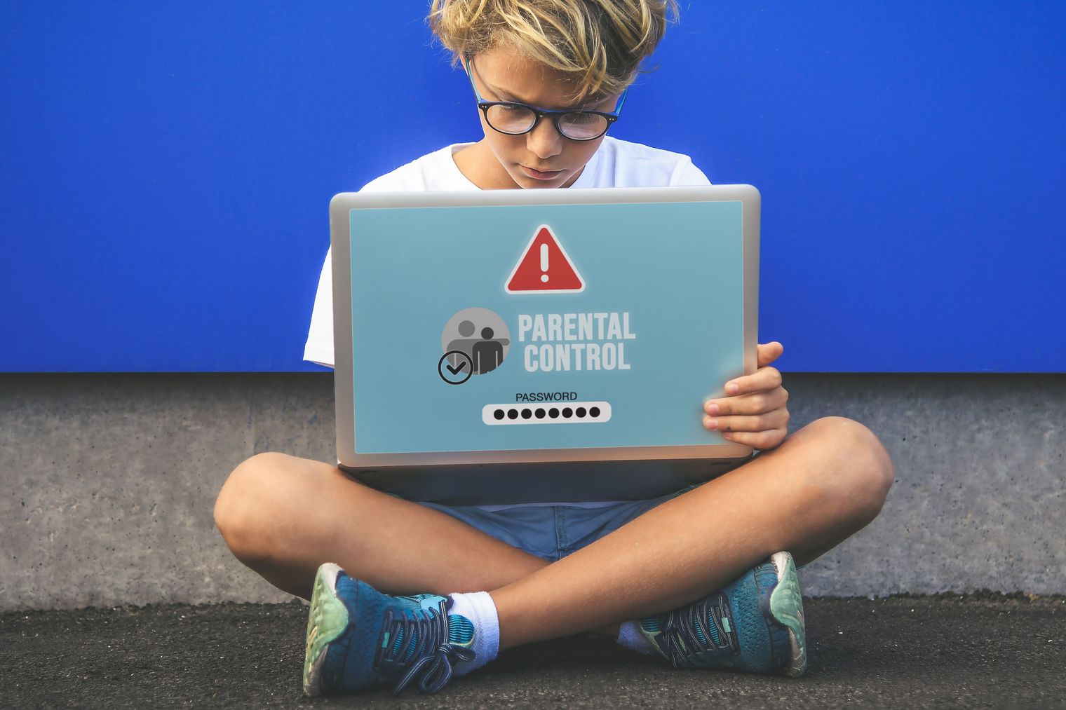 adolescent boy sitting with laptop. Text says Parental Control.