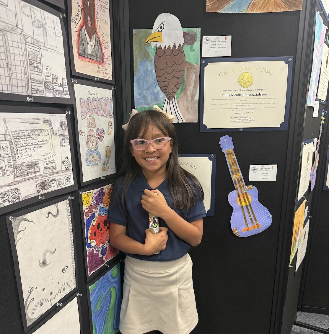 student artist with her eagle art