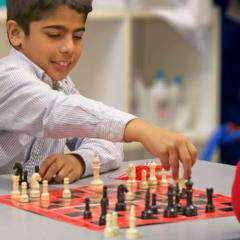 boy playing chess