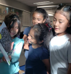 Students looking at a new book